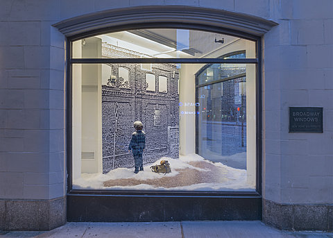 A corner window displaying a small child in pajamas facing a wall in a snowy scene. A small dog in a handbag lies beside the child.