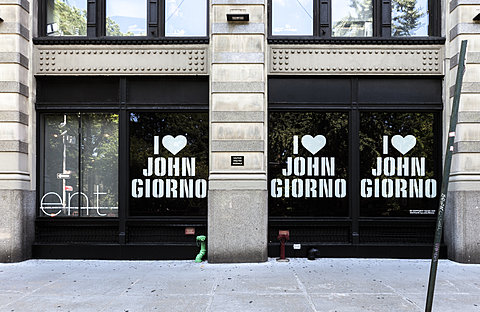 Three window displays display the text "I ♥ John Giorno" in white against a black background.